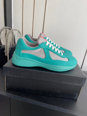 PRADA 26S AMERICA CUP SNEAKERS IN TEAL BLUE SOFT RUBBER AND BIKE FABRIC