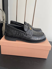 MIUMIU 26S PENNY LOAFERS IN BLACK CALFSKIN CROCODILE EMBOSSING