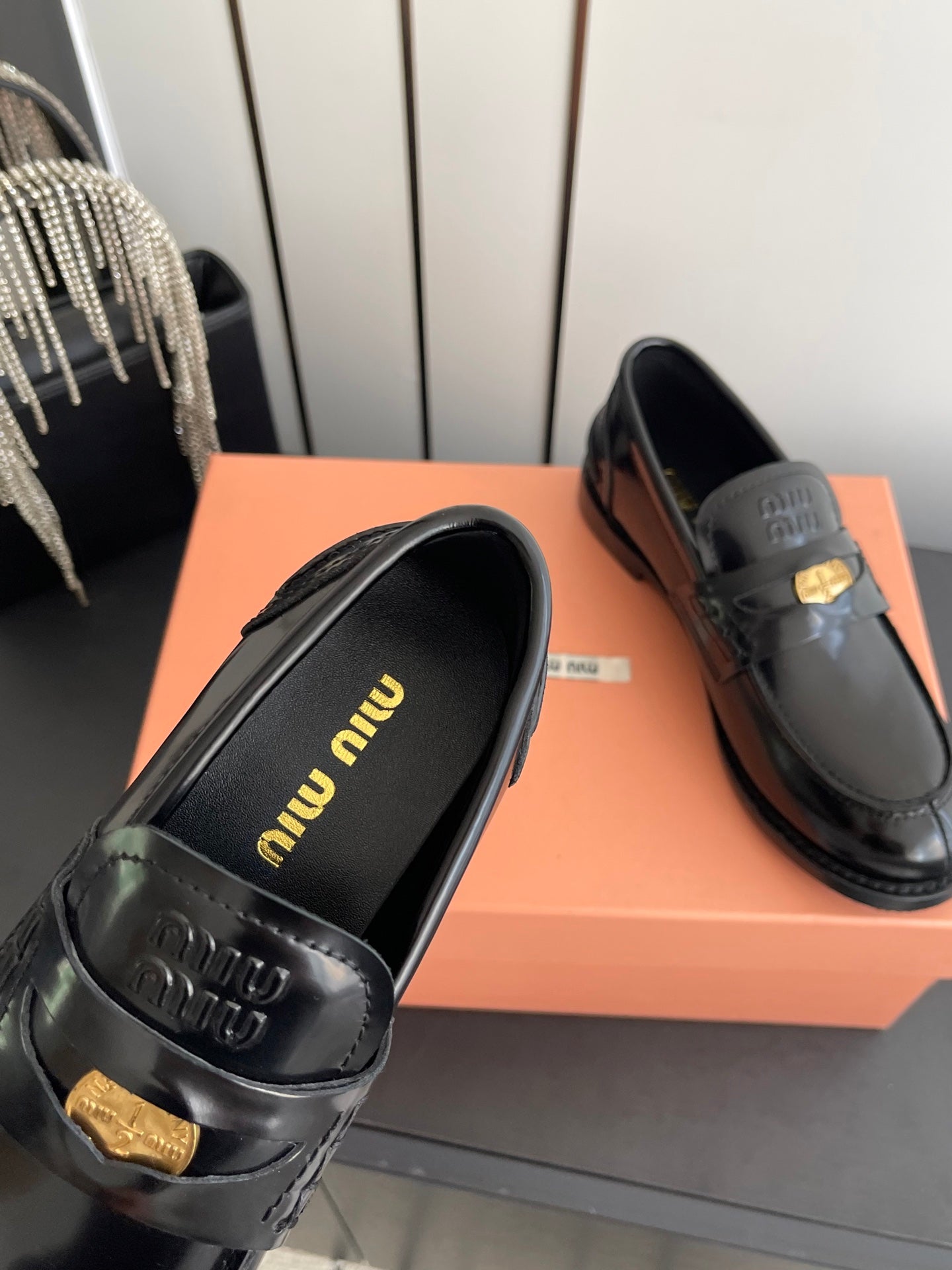 MIUMIU 26S PENNY LOAFERS IN BLACK GLOSSY CALFSKIN GOLD HARDWARE