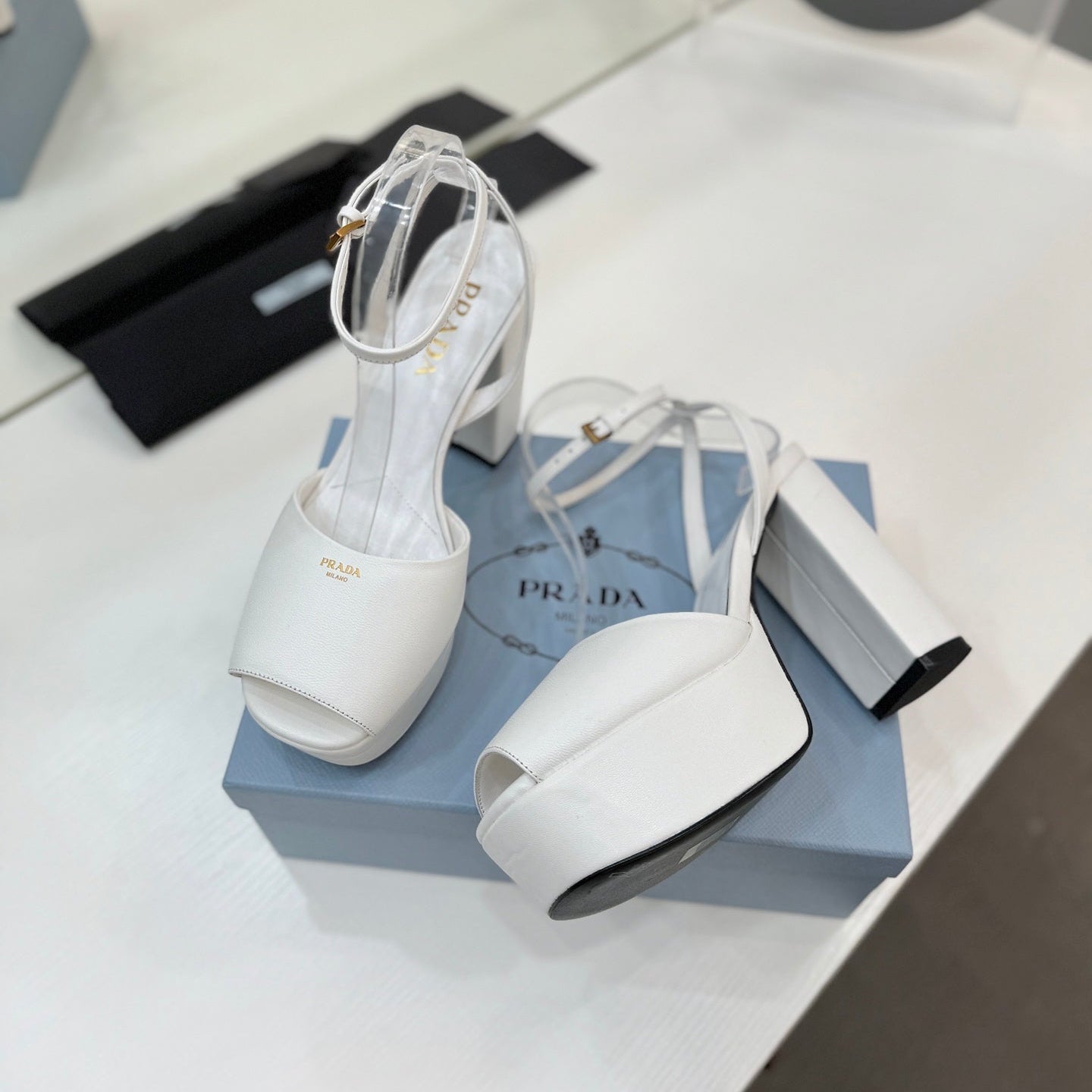 PRADA 26S HEELED SANDALS 115MM IN WHITE CALFSKIN
