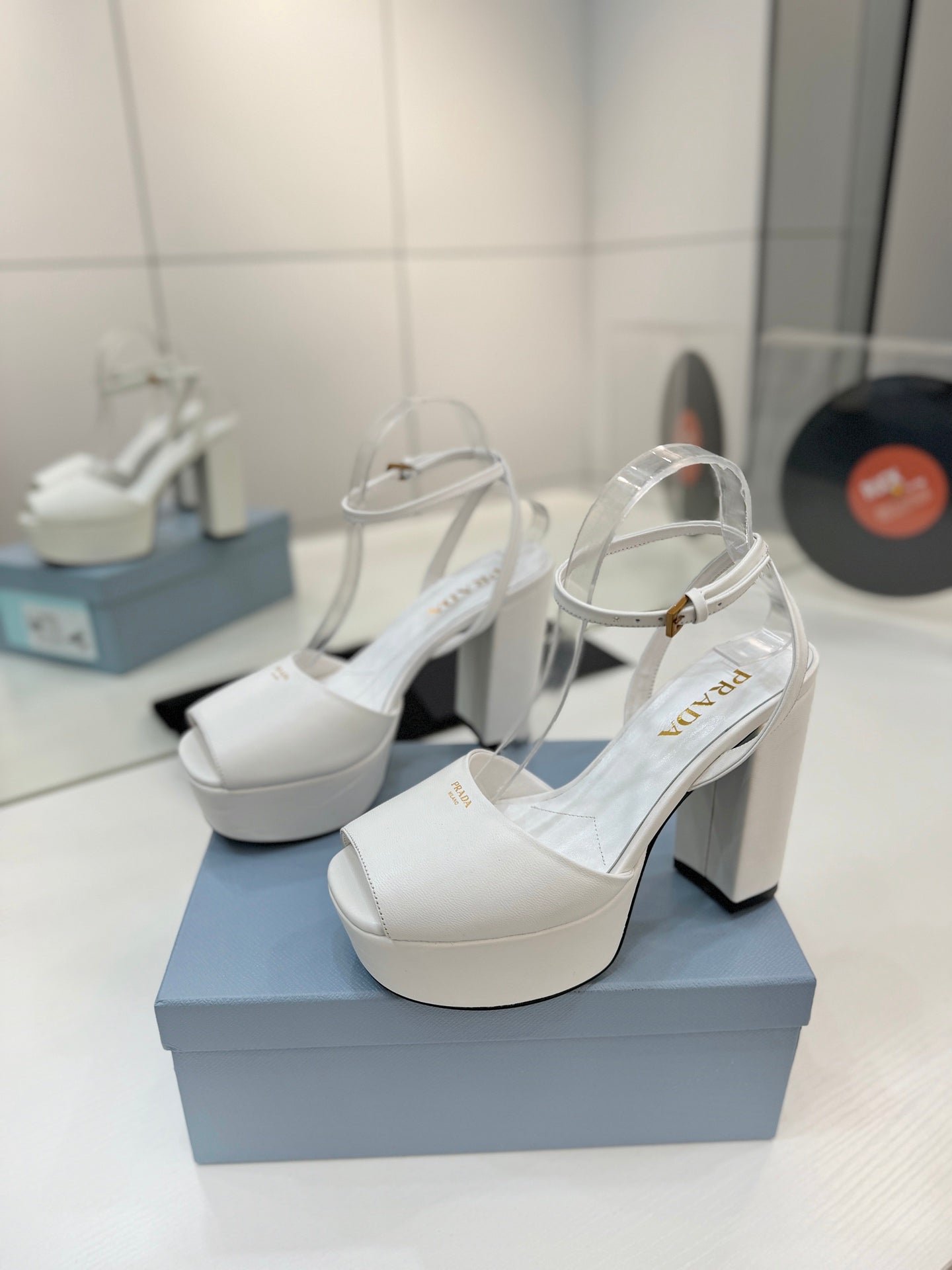 PRADA 26S HEELED SANDALS 115MM IN WHITE CALFSKIN