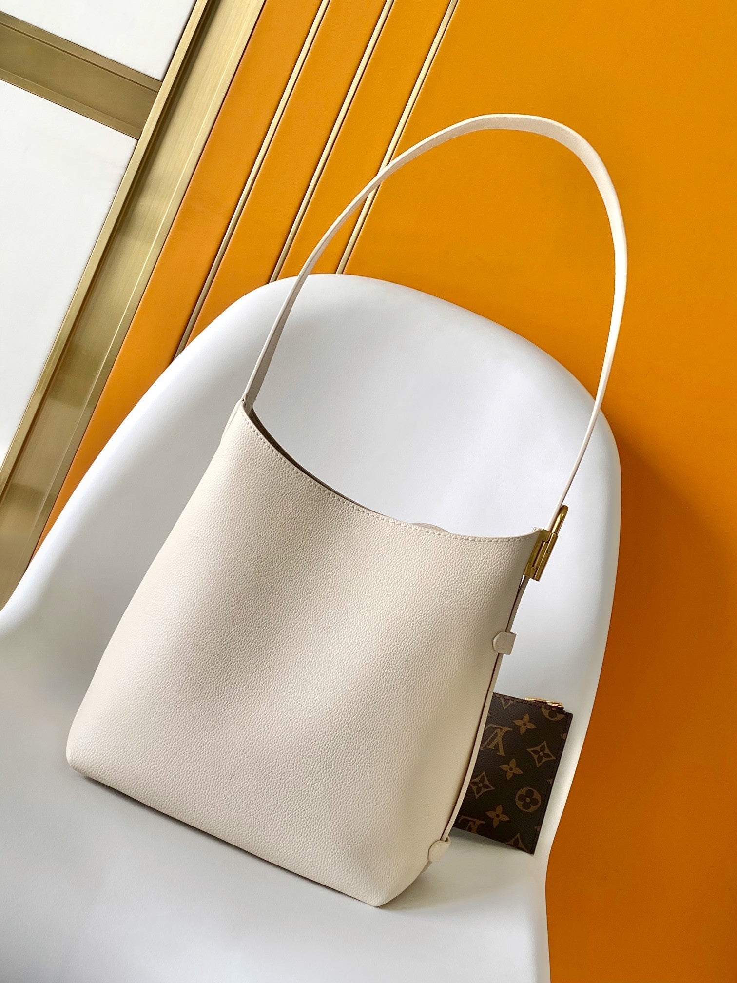 LV 25S LOW KEY HOBO BAG 35 CM IN CREAM WHITE CALFSKIN