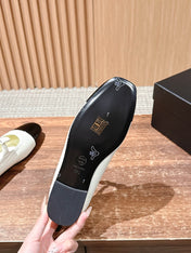 CHANEL 25S BALLET MARY JANES BLACK AND IVORY IN CALFSKIN