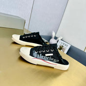 SNEAKER MULES IN BLACK CANVAS GRAFFITI LOGO
