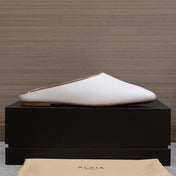 ALAIA FLAT MULE IN WHITE LAMBSKIN