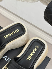 PLATFORM SLIPPERS IN BLACK LAMBSKIN