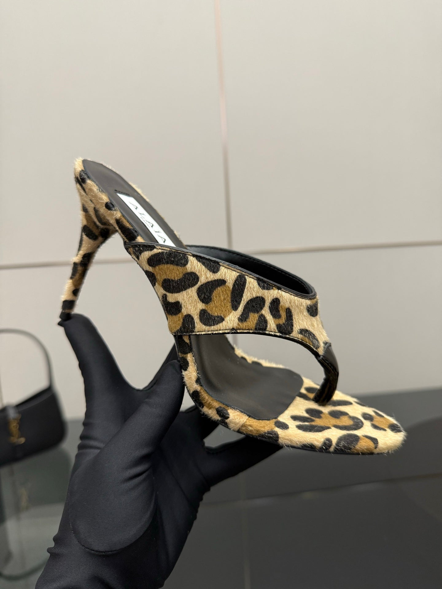 ALAIA HEELED THONG 25S IN LEOPARD PONY HAIR LEATHER
