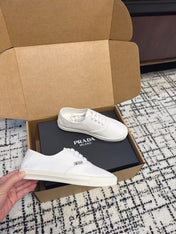 PRADA 26S LACE UP SNEAKERS IN WHITE CANVAS