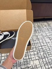 PRADA 26S LACE UP SNEAKERS IN BLACK AND WHITE CANVAS