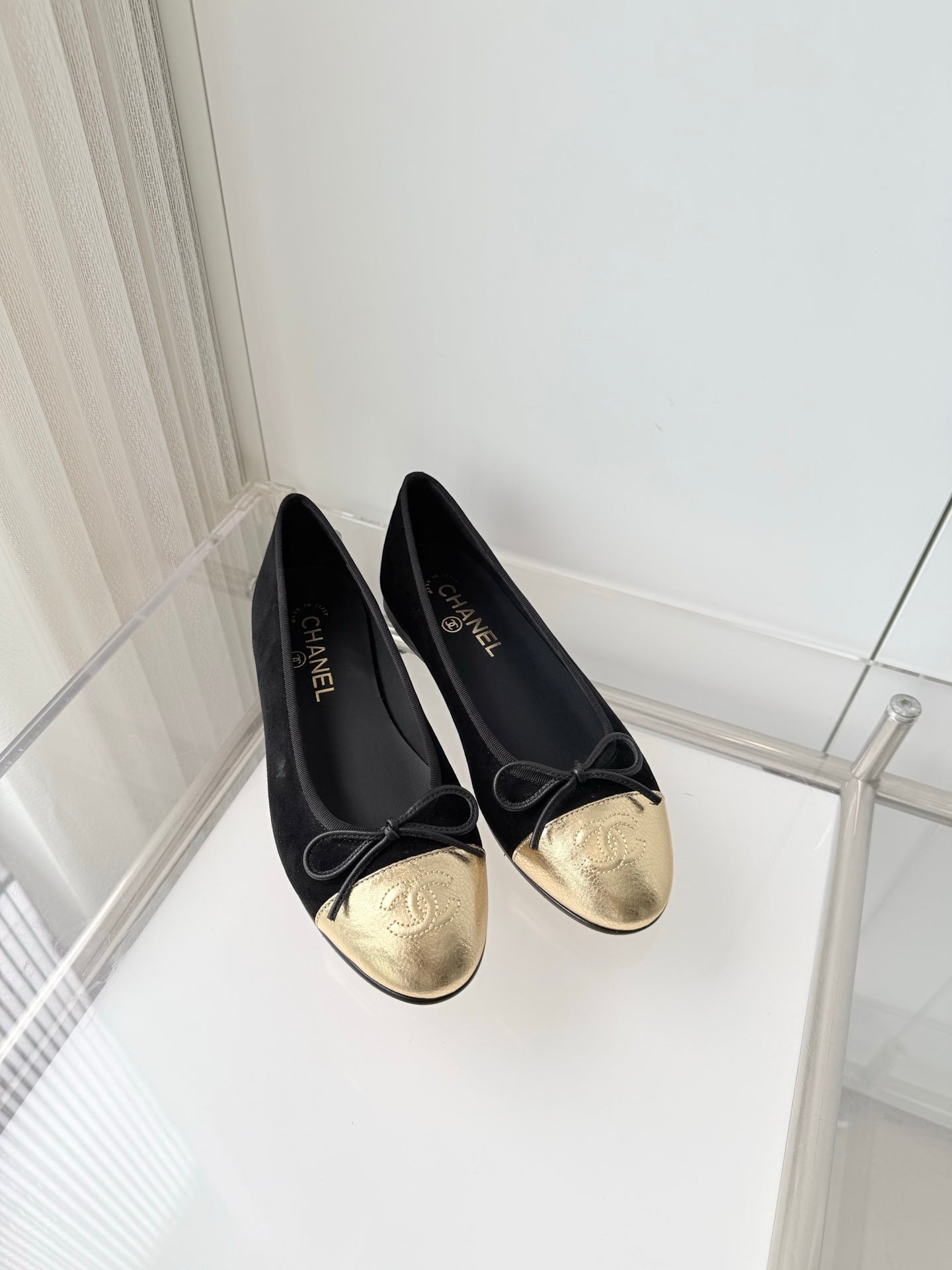 CHANEL 26S BALLET FLATS IN BLACK SUEDE WITH GOLD TOE CAP AND BOW