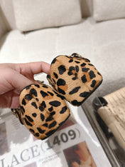 ALAIA 25S CRISS CROSS BALLET FLATS IN LEOPARD SUEDE