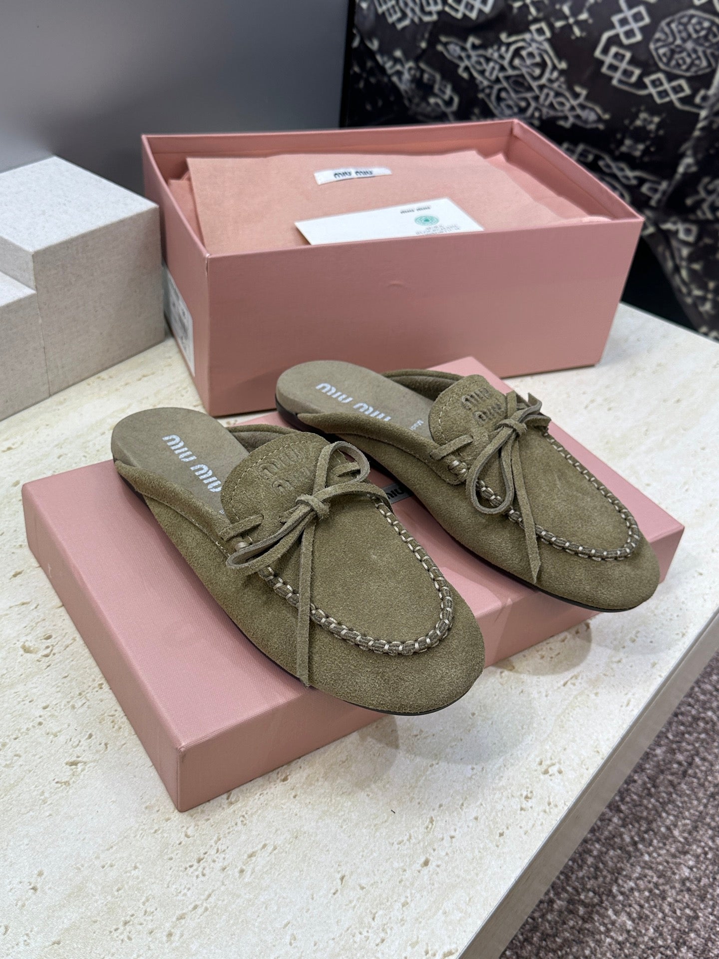 MIUMIU 26S SNEAKER MULES IN DARK OLIVE GREEN SUEDE WITH BOW