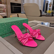 BOW-EMBELLISHED HIGH MULES IN HOT PINK SHEEPSKIN