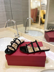VALENTINO 26S ROCKSTUD CAGED SANDALS IN BLACK PATENT CALFSKIN
