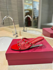 ROCKSTUD MULE SANDALS IN CHERRY RED CALFSKIN AND TRANSPARENT PVC FILM