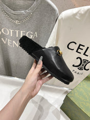 HORSEBIT MULE IN BLACK CALFSKIN AND FLEECE LINING