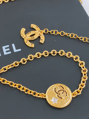 TWISTED CHAIN BELT WITH RHINESTONES AND LOGO PLATE IN GOLD TONE