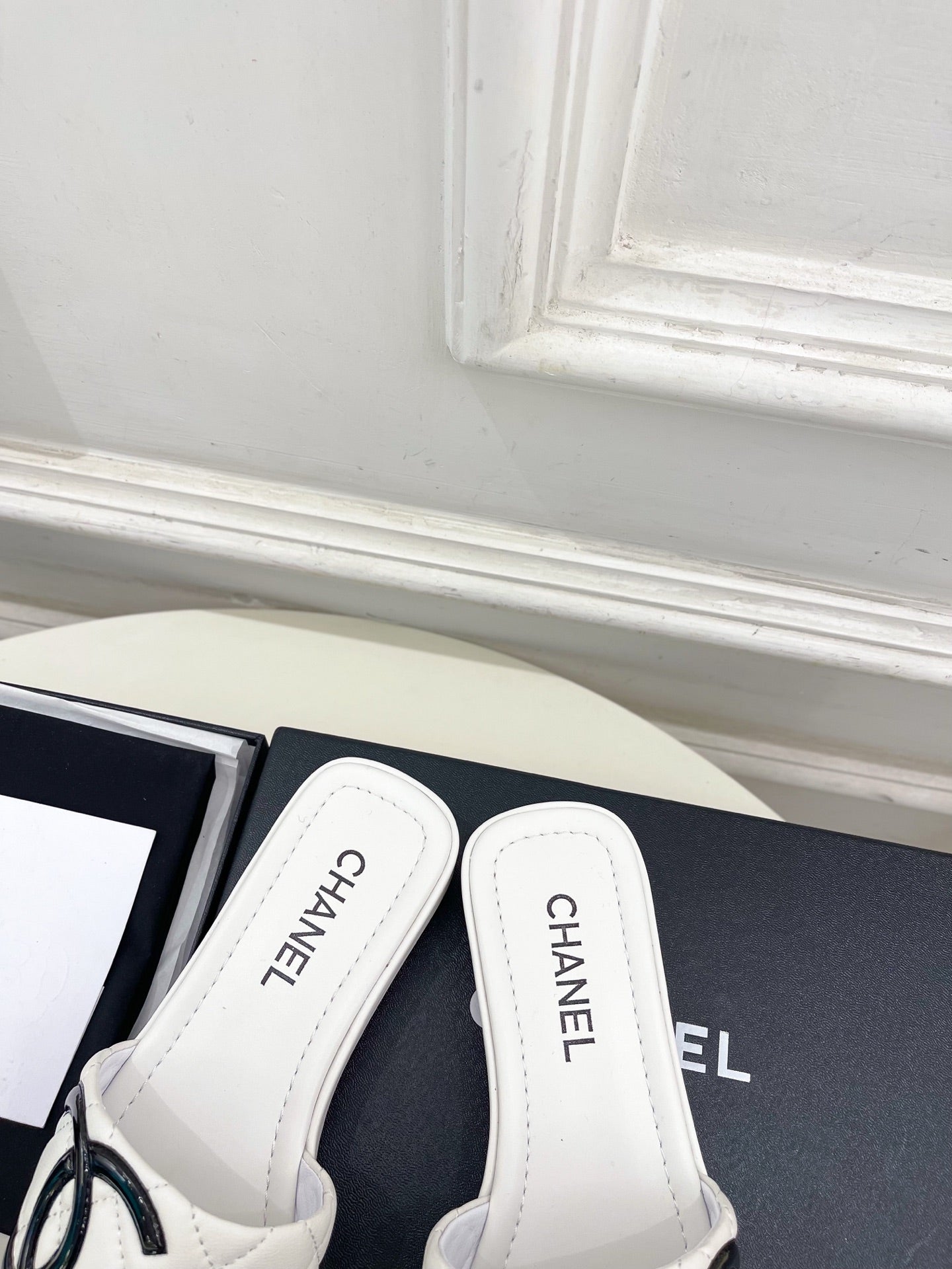 CHANEL 26S FLAT SLIDES IN WHITE LAMBSKIN WITH BLACK CC LOGO