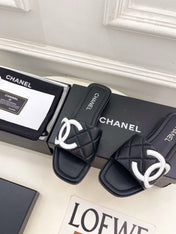 CHANEL 26S FLAT SLIDES IN BLACK LAMBSKIN WITH WHITE CC LOGO