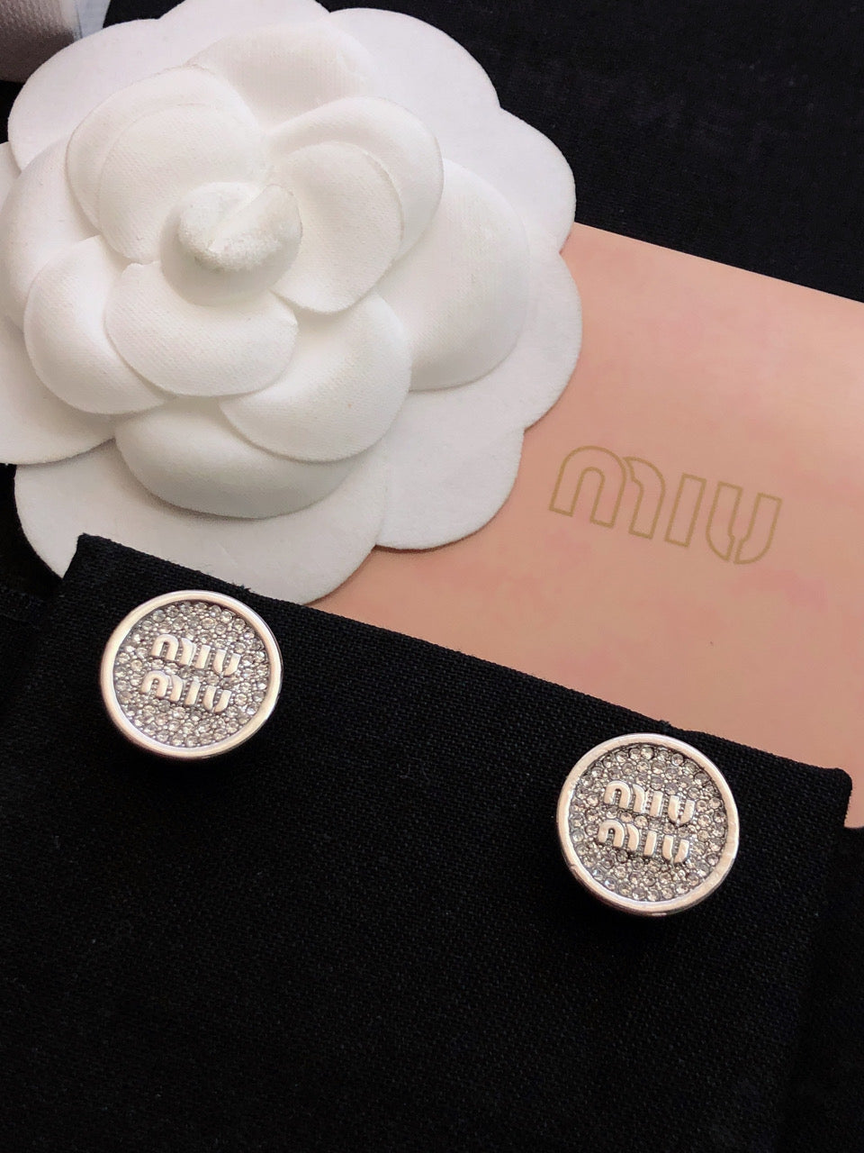 MIUMIU 26S CRYSTAL MIU LOGO ROUND STUD EARRINGS IN SILVER TONE METAL 630845