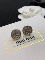 MIUMIU 26S CRYSTAL MIU LOGO ROUND STUD EARRINGS IN SILVER TONE METAL 630845